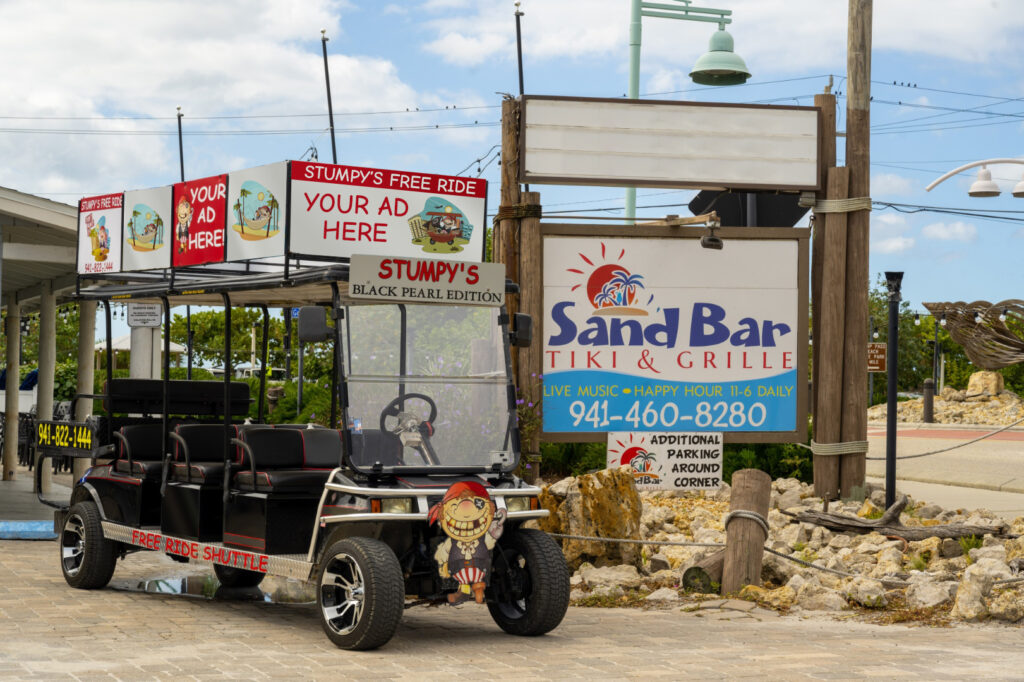 Stumpy's Free Ride golf cart shuttle at SandBar Tiki & Grille on Manasota Key